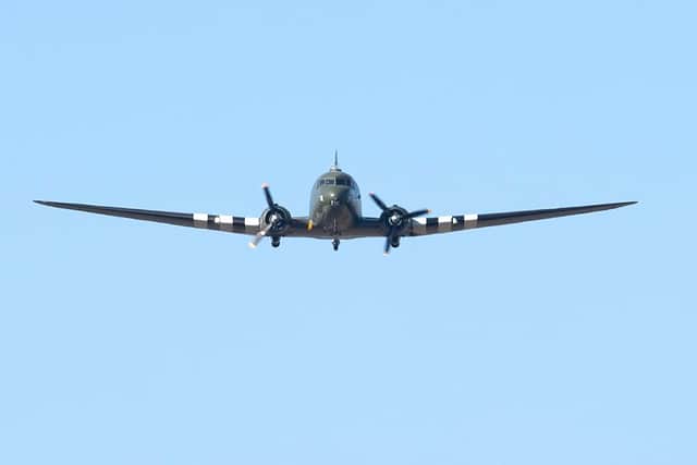 A Dakota performs a fly-pass at the funeral. PIC: Joe Giddens/PA Wire