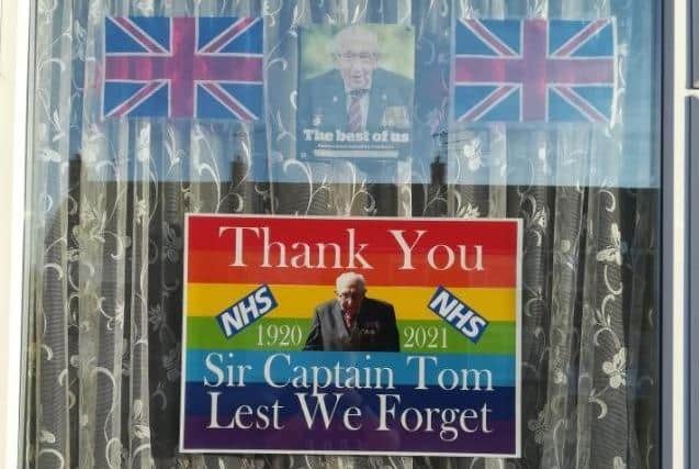 A tribute to Captain Sir Tom Moore in the window of a house in Hull. PIC: @Kupokuponut/PA Wire