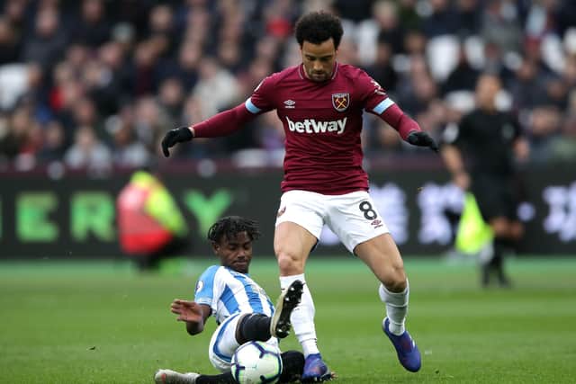 Huddersfield Town's Aaron Rowe battles for the ball during his first start for the Terriers at West Ham United in March 2019. Picture: John Walton/PA
