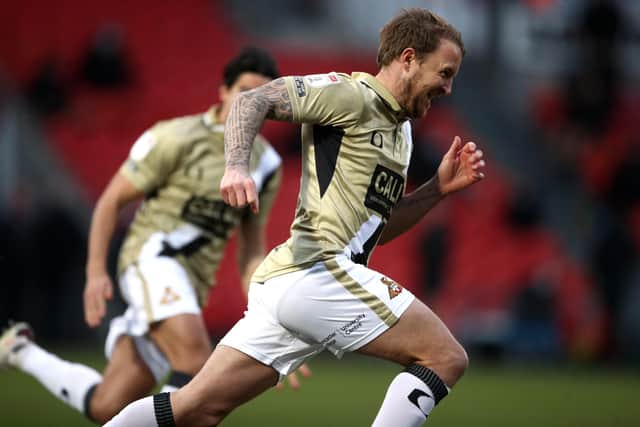 Doncaster Rovers' James Coppinger celebrates scoring their sides third goal to level the score at 3-3 against Hull City. Picture: Tim Goode/PA
