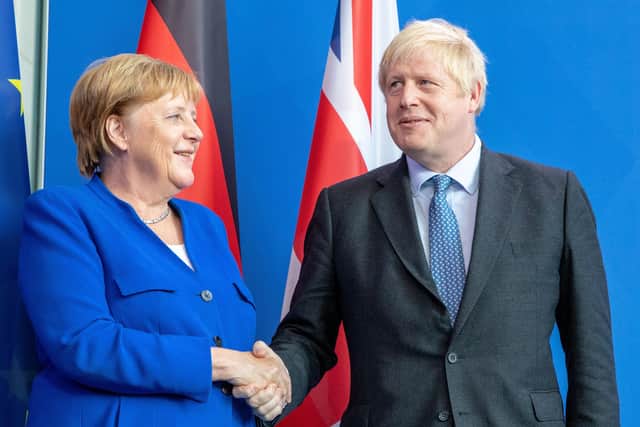 Boris Johnson with Germany's leader Angela Merkel.