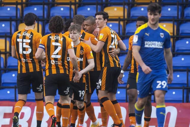 Josh Magennis, centre, is congratulated for his goal by Hull team-mates (Picture: PA)