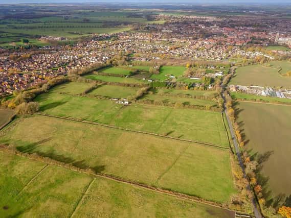 The homes will be built on fields off Long Lane