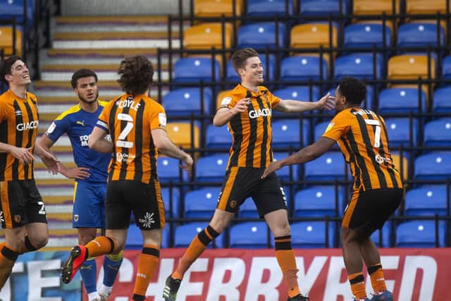 Hull's Reece Burke (second right) celebrates scoring his side's second goal against Wimbledon. Picture: Victoria Jones/PA