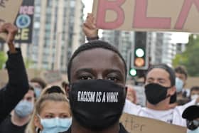 A man at a Black Lives Matter protest in London in June 2020. Picture by Steve Eason on Flicker via the University of Leeds.