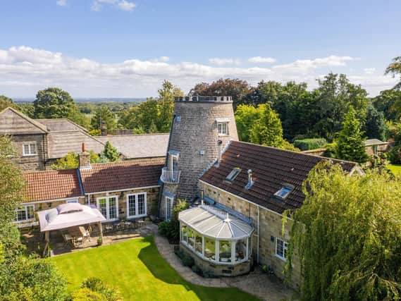 The converted windmill and its extensions add up to a large family home