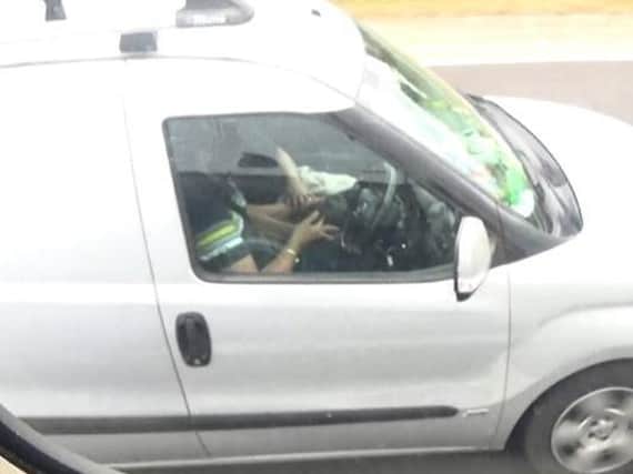 The man who took both hands off the wheel to use his phone.