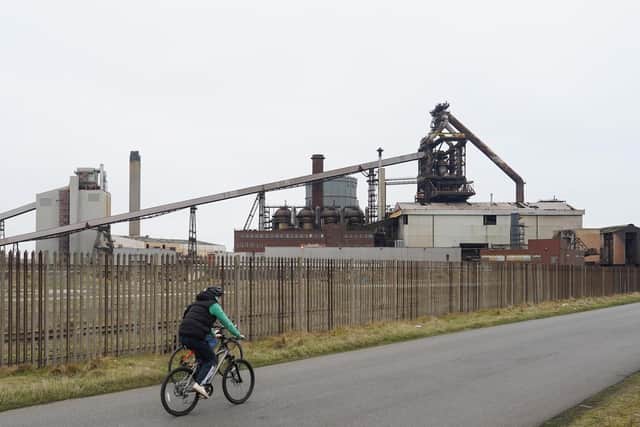 Cyclists ride past the former SSI steel blast furnace as an expected announcement is due tomorrow about the successful Freeport bids on March 02, 2021 in Teesport, England. 30 sites around the UK are bidding to be one of ten new Freeports. Freeports are areas around a maritime port or airport where goods can be imported without having to pay import tariffs. Goods are either exported without paying taxes at all or relevant taxes paid when goods are transported into the UK. (Photo by Ian Forsyth/Getty Images)