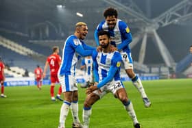 Fraizer Campbell celebrates scoring Huddersfield's opening goal with Juninho Bacuna and Duane Holmes.  Picture Bruce Rollinson
