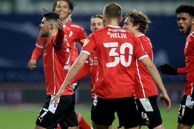 Barnsley's Alex Mowatt (left) celebrates scoring their side's second goal (Picture: PA)