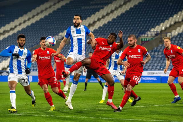 Alex Vallejo and Jeremie Bela challenge for a corner ball during 
Huddersfield Town's draw with Birmingham City (Picture: Bruce Rollinson)