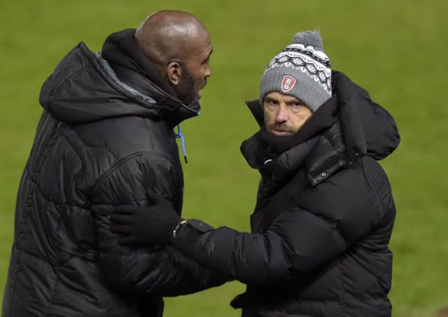 Owls manager Darren Moore in charge of his first game with Rotherham's Paul Warne.  (Picture: Steve Ellis)