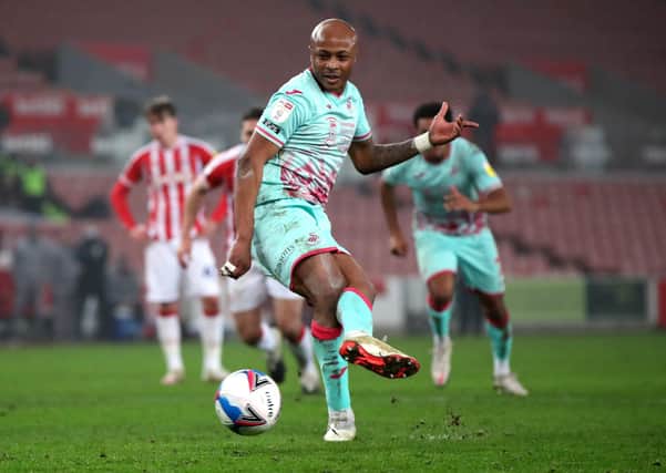 In form: Swansea City's Andre Ayew scores their side's second goal from the penalty spot against Stoke. Picture: Nick Potts/PA