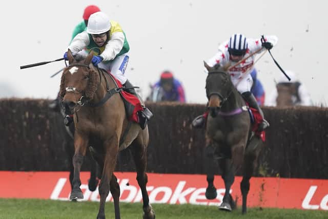 Cloith Cap and Tom Scudamore surge clear to win the n the Ladbrokes Trophy at Newbury.