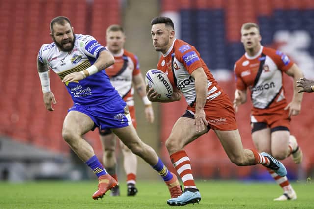 One to watch: Salford's Niall Evalds runs in open space as Leeds' Adam Cuthbertson chases him in the Challenge Cup final.