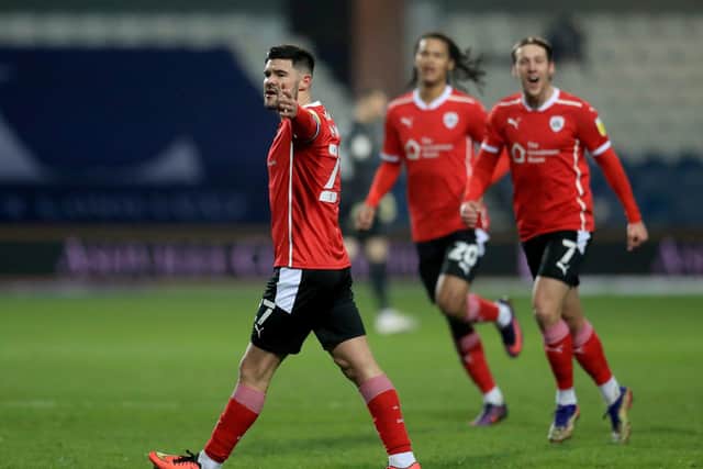 Barnsley's Alex Mowatt celebrates scoring their side's second goal at QPR in the visitors' 3-1 midweek win. Picture: Adam Davy/PA.