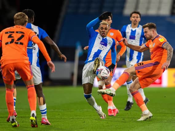 Huddersfield Town's Juninho Bacuna sticks a foot in against Cardiff City. Picture: BRUCE ROLLINSON.