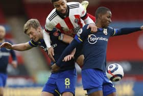 CHALLENGE: Jayden Bogle competes for the ball with Southampton's James Ward-Prowe and Ibrahima Diallo