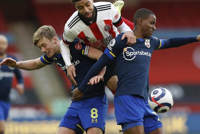 CHALLENGE: Jayden Bogle competes for the ball with Southampton's James Ward-Prowe and Ibrahima Diallo