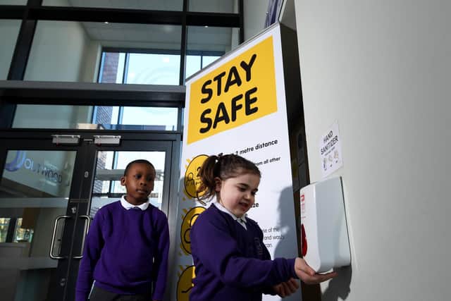 Outwood Primary Academy, Brandy Carr Road, Kirkhamgate, Wakefield. Libby Riley and Daniel Akindipe are pictured sanatising there hands at the school..5th March 2021. Photo credit: Simon Hulme/JPIMediaResell