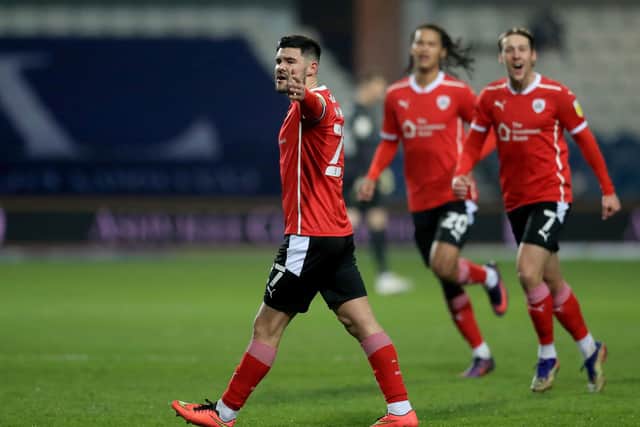 Barnsley's Alex Mowatt celebrates scoring their side's second goal against QPR (Picture: PA)
