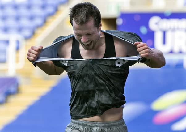 Angry: Owls defender Julian Borner takes his frustration out on his shirt after being sent off. Picture: Steve Ellis