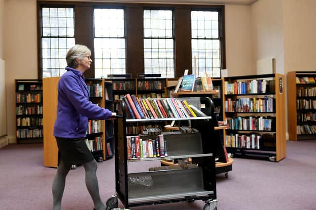 Jean Morby at Harrogate Library arranging books for the Home Library Service. Image by Gary Longbottom.