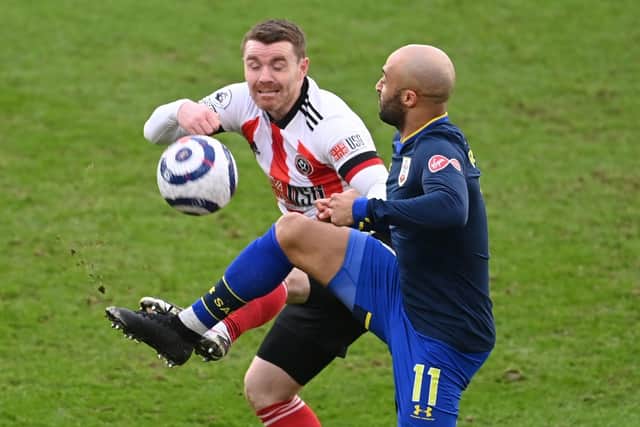 Sheffield United's John Fleck and Southampton's Nathan Redmond battle for the ball.