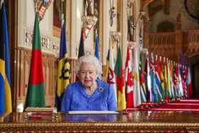 Queen Elizabeth II signs her annual Commonwealth Day Message in St George's Hall at Windsor Castle. PA Photo. Issue date: Friday March 5, 2021. Picture: Steve Parsons/PA Wire