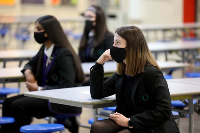 Pupils in England will be asked to wear masks in class as they return to school today. Pictured: Pupils at Rosshall Academy wear face coverings as it becomes mandatory in corridors and communal areas on August 31, 2020 in Glasgow, Scotland. (Photo by Jeff J Mitchell/Getty Images)