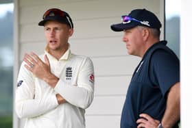IN AND OUT: England captain Joe Root speaks with coach Chris Silverwood. Picture: Gareth Copley/Getty Images.