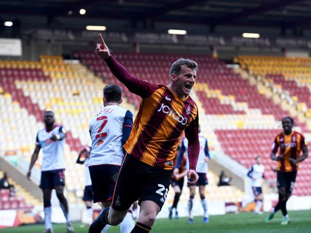 DELIGHT: Danny Rowe wheels away after scoring a stoppage-time equaliser for Bradford City. Picture: Simon Hulme.