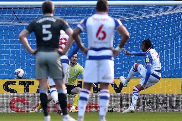 OPENER: Reading's Michael Olise (right) scores the first goal of the game. Picture: PA Wire.