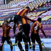 LATE DRAMA: Bradford City players celebrate their equaliser against Bolton. Picture: Simon Hulme.