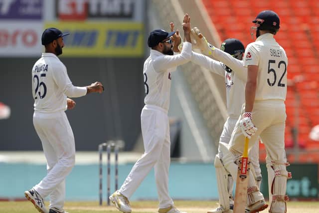 Out: India celebrate tthe dismissal of Dom Sibley.