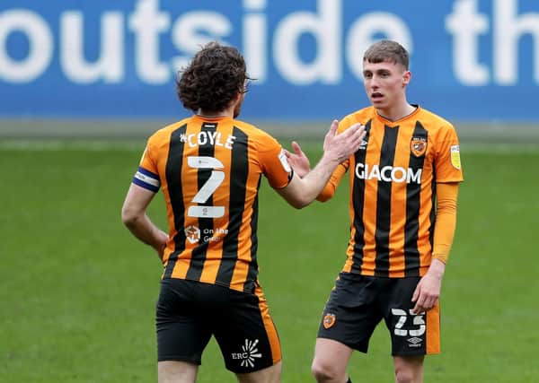 Well done: Hull City's Lewis Coyle congratulates Gavin Whyte after scoring his second goal. Picture: Richard Sellers/PA