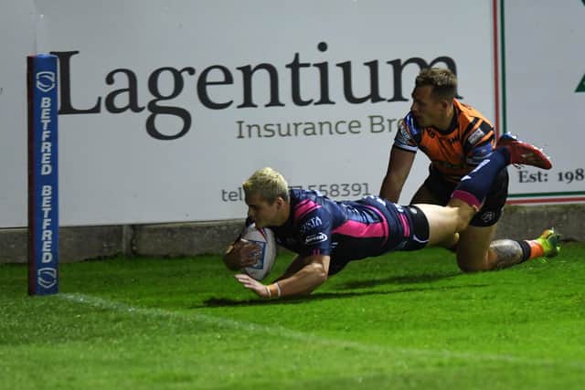 No stopping him: Cameron Scott scores for Hull against Castleford Tigers last season. Picture: Jonathan Gawthorpe
