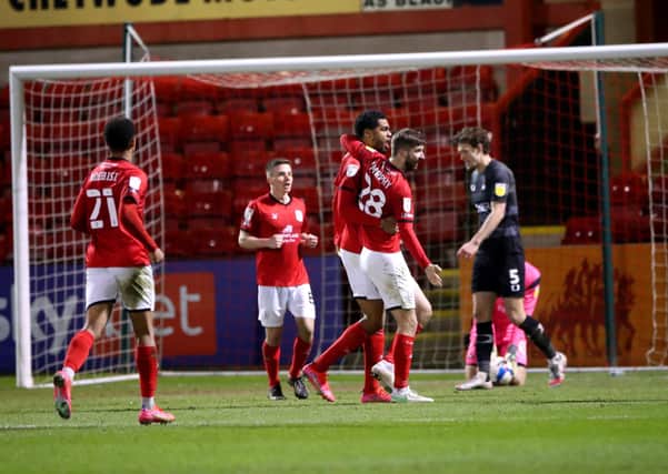 Crewe Alexandra's Mikael Mandron (centre left) celebrates scoring. Pictures: PA.