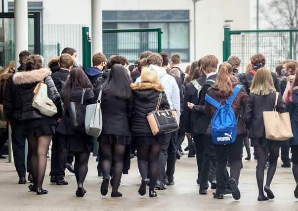 Students arrive at Outwood Academy in Woodlands, Doncaster in Yorkshire, as pupils in England return to school for the first time in two months as part of the first stage of lockdown easing.