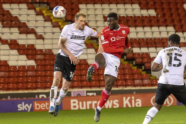 Barnsley striker Daryl Dike heads on goal in the first half.  Picture: Tony Johnson