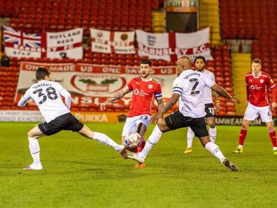 Action from Barnsley's draw with Derby with Alex Mowatt at centre stage.