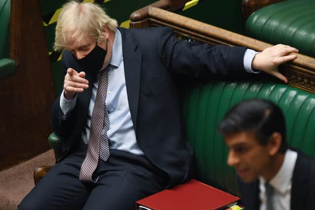Boris Johnson points the finger at Labour during Rishi Sunak's Budget speech.