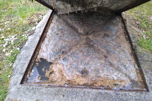 A manhole brimming with sewage