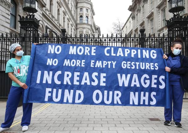 NHS staff protest outside 10 Downing Street over the proposed one per cent pay offer.