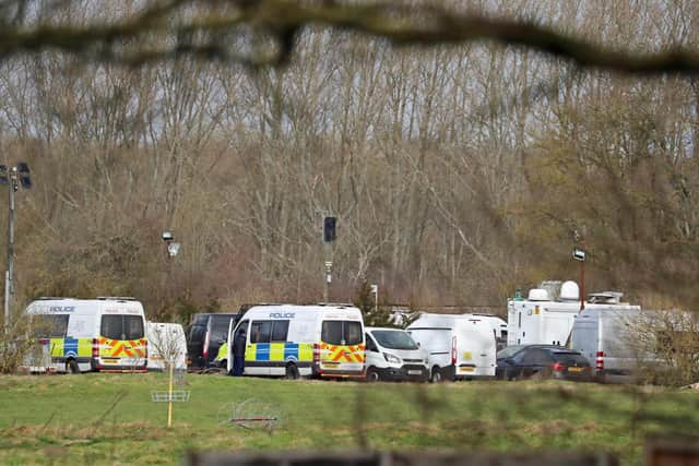 Police vehicles parked at Great Chart Golf and Leisure near Ashford in Kent following the discovery of human remains in the hunt for missing Sarah Everard