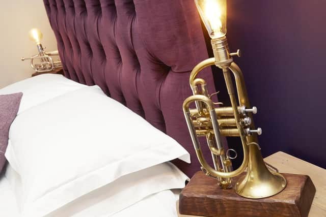 The Cornet lamp in one of the guest bedrooms - the music room - made by Frankie Farrar of Stirring Silver