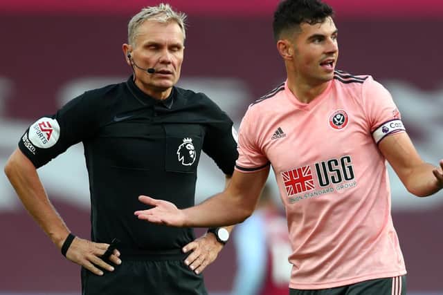Turning point - Sheffield United's John Egan reacts after getting sent off against Aston Villa back in September (Picture: PA)