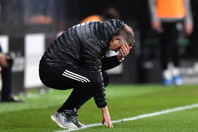 Sheffield United manager Chris Wilder crouches in frustration after a costly defeat at Fulham (Picture: PA)