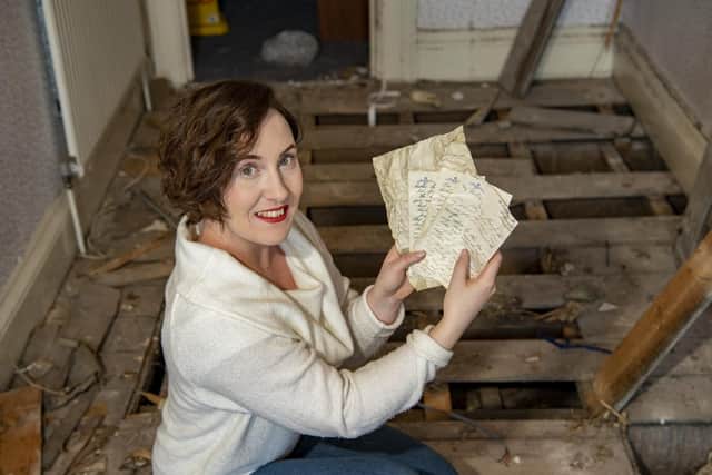 Historian Marie Woods holds love letters written at the height of WWII which were discovered under floorboards of the Esplanade Hotel, Scarborough