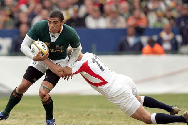 England's Dan Scarbrough, right, tackles South Africa's Bryan Habana, left, during his second rugby test match against South Africa at Loftus Versfeld in Pretoria, South Africa, June 2, 2007. (AP Photo/Themba Hadebe)